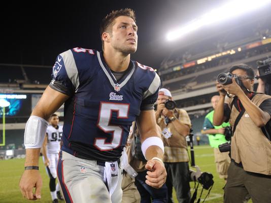 Aug 9, 2013; Philadelphia, PA, USA; New England Patriots quarterback Tim Tebow (5) leaves the field after the second half of a preseason game against the Philadelphia Eagles at Lincoln Financial Field. The Patriots won 31-22. Mandatory Credit: Joe Camporeale-USA TODAY Sports 
