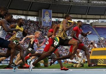 United States' Justin Gatlin, right, and Jamaica's Usain Bolt, second from right, run after receiving the baton in the men's 4x100-meter relay final at the World Athletics Championships in the Luzhniki stadium in Moscow, Russia, Sunday, Aug. 18, 2013. (AP Photo/Matt Dunham)