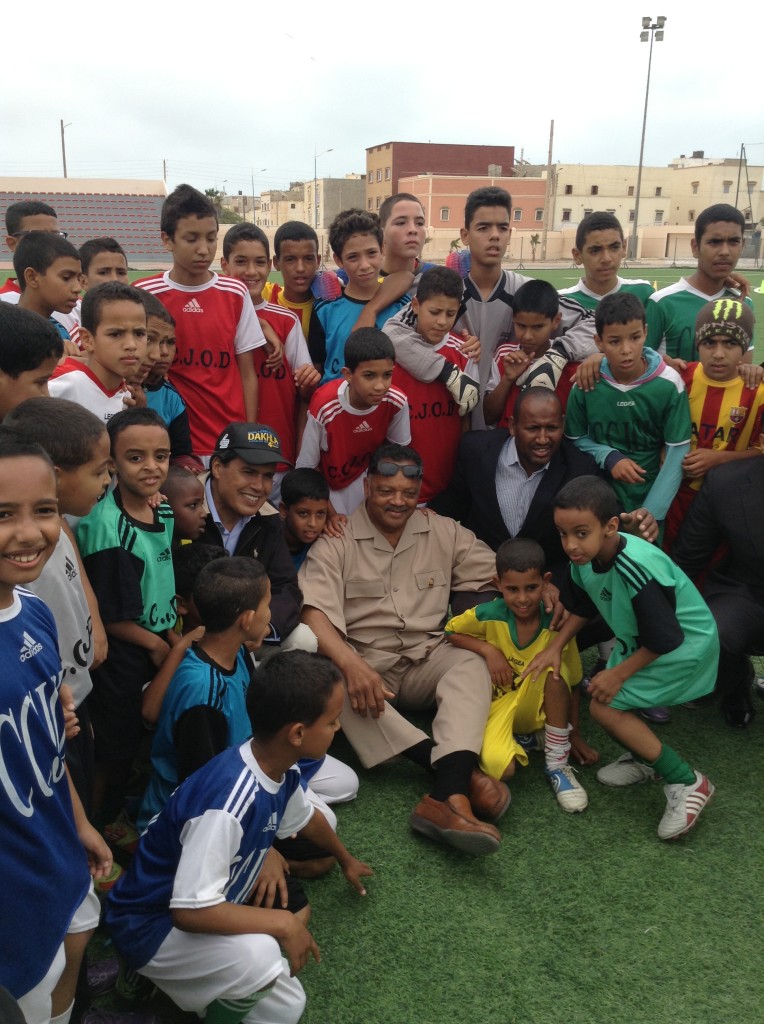 Jesse Jackson surrounded by soccer players in Dakhla, Morocco (NNPA Photo by George E. Curry).