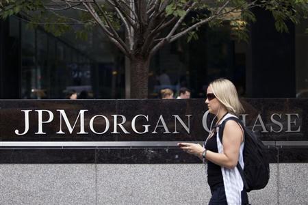 Woman walks past JP Morgan Chase's international headquarters on Park Avenue in New York