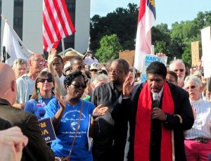 Rev. Dr. William Barber speaking at a Moral Monday rally.