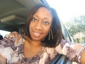 This undated family photo provided by Lincoln B. Alexander shows, Marissa Alexander in her car in Tampa, Fla. Alexander had never been arrested before she fired a bullet at a wall one day in 2010 to scare off her husband when she felt he was threatening her. Nobody got hurt, but this month a northeast Florida judge was bound by state law to sentence her to 20 years in prison. (AP Photo/Lincoln B. Alexander)