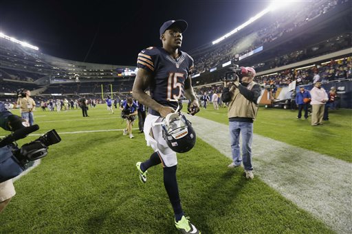 Chicago Bears wide receiver Brandon Marshall runs off the field after the Bears' 27-21 win over the New York Giants in an NFL football game, Thursday, Oct. 10, 2013, in Chicago. (AP Photo/Nam Y. Huh)
