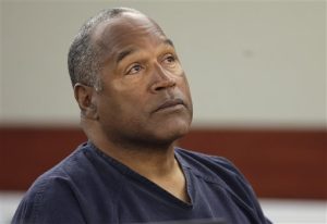 FILE - This May 13, 2013 file photo shows O.J. Simpson listening to testimony at an evidentiary hearing in Clark County District Court in Las Vegas. A judge in Las Vegas rejected O.J. Simpson's bid for a new trial on Tuesday, Nov. 26, 2013, dashing the former football star's bid for freedom based on the claim that his original lawyer botched his armed robbery and kidnapping trial in Las Vegas more than five years ago. "All grounds in the petition lack merit and, consequently, are denied," Clark County District Judge Linda Marie Bell said. (AP Photo/Julie Jacobson, Pool, File)