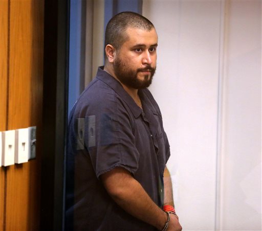 George Zimmerman, acquitted in the high-profile killing of unarmed black teenager Trayvon Martin, listens in court Tuesday, Nov. 19,  2013, in Sanford, Fla., during his hearing on charges including aggravated assault stemming from a fight with his girlfriend.  (AP Photo/Orlando Sentinel, Joe Burbank, Pool)