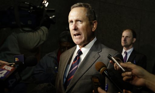 Mike McCrum, lead attorney for former NFL wide receiver Sam Hurd, speaks to reporters outside a federal court building after Hurd's sentencing in Dallas, Wednesday, Nov. 13, 2013. Hurd was sentenced to 15 years in prison for his role in starting a drug-distribution scheme while playing for the Chicago Bears, completing a steep downfall that ended his football career and left his future in tatters. (AP Photo/LM Otero)