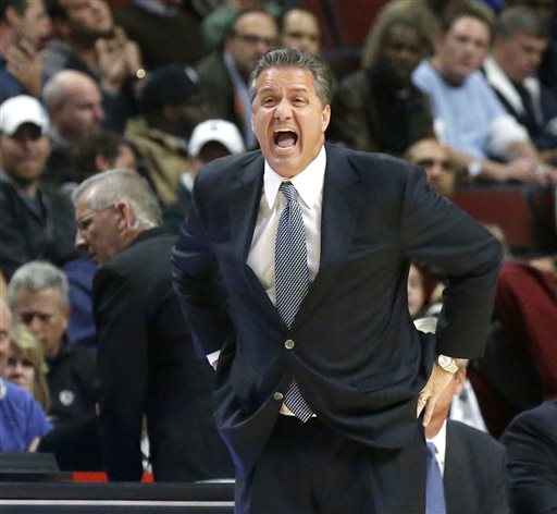 Kentucky coach John Calipari yells to his team during the first half of an NCAA college basketball game against Michigan State on Tuesday, Nov. 12, 2013, in Chicago. (AP Photo/Charles Rex Arbogast)