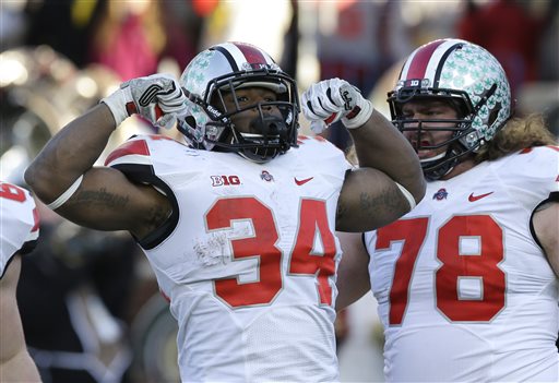 Ohio State running back Carlos Hyde (34) reacts after his touchdown during the second half of an NCAA college football game against Michigan in Ann Arbor, Mich., Saturday, Nov. 30, 2013. Ohio State defeated Michigan 42-41. (AP Photo/Carlos Osorio)