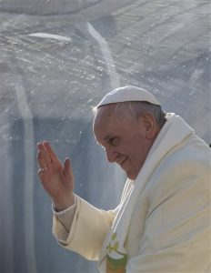 Pope Francis waves as he leaves after his weekly general audience in St. Peter's Square at the Vatican, Wednesday, Dec. 11, 2013. (AP Photo/Alessandra Tarantino)