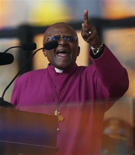 Retired Anglican Archbishop Desmond Tutu speaks at the memorial service for former South African president Nelson Mandela at the FNB Stadium in Soweto near Johannesburg, Tuesday, Dec. 10, 2013. (AP Photo/Matt Dunham)