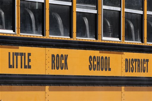 A school bus is parked near Little Rock Central High School in Little Rock, Ark., Monday, Jan.13, 2014. A federal judge began hearing arguments Monday about whether to approve a settlement agreement that would allow the state to stop making payments to help fund racial integration in three Little Rock-area school districts. (AP Photo/Danny Johnston)