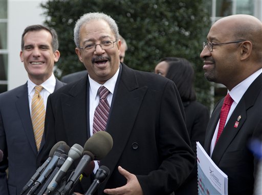 Rep. Chaka Fattah, D-Pa., center, flanked by Los Angeles Mayor Eric Garcetti, left, and Philadelphia Mayor Michael Nutter, right, speaks outside the White House in Washington, Thursday, Jan. 9, 2014, after an event hosted by President Barack Obama about the Promise Zones Initiative. The Promise Zone Initiative is part of a plan to create a better bargain for the middle-class by partnering with local communities and businesses to create jobs, increase economic security, expand educational opportunities, increase access to quality, affordable housing and improve public safety. (AP Photo/Carolyn Kaster)