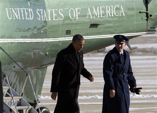 President Barack Obama, escorted by Colonel William M. Knight, Commander of the 11th Wing, walks toward Air Force One from the Marine One helicopter, upon arrival at Andrews Air Force Base, Md., Thursday, Jan. 30, 2014, en route to Waukesha, Wis., to speak about job training. ( AP Photo/Jose Luis Magana)