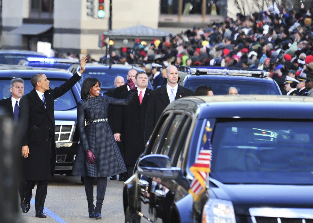 President Barack Obama and First Lady Michelle Obama greet parade attendants during the Inaugural Parade on Pennsylvania Avenue in Washington, D.C. following the swearing-in ceremony.