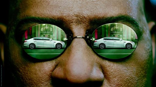 This undated frame grab provided by Kia shows the company's 2014 Super Bowl commercial. The third-quarter ad to introduce its K900 luxury sedan, features Laurence Fishburne reprising his Matrix role as Morpheus and displays some surprising operatic skills. (AP Photo/Kia)