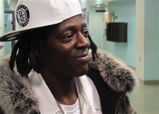 Flavor Flav speaks with reporters following an appearance in Nassau County District Court in Hempstead, N.Y., on Tuesday, Jan. 28, 2014. (AP Photo/Frank Eltman)