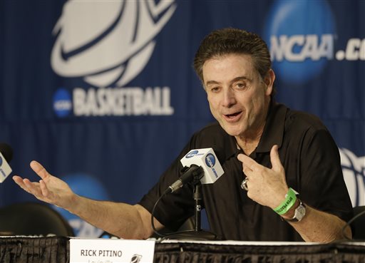 Louisville head coach Rick Pitino answers questions at a news conference for the NCAA college basketball tournament in Orlando, Fla., Wednesday, March 19, 2014.  Manhattan plays against Louisville in a second round game on Thursday. (AP Photo/John Raoux)