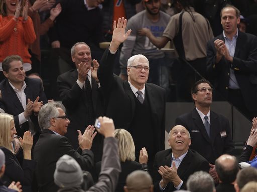 Phil Jackson waves to the crowd as he is introduced during the first half of an NBA basketball game between the New York Knicks and the Indiana Pacers at Madison Square Garden on Wednesday, March 19, 2014, in New York. Jackson was hired as the president of the Knicks this week. (AP Photo/Seth Wenig)