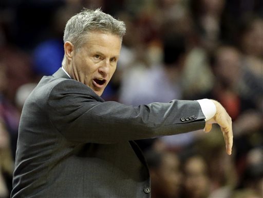 Philadelphia 76ers coach Brett Brown talks to his team during the first half of an NBA basketball game against the Chicago Bulls in Chicago on Saturday, March 22, 2014. (AP Photo/Nam Y. Huh)