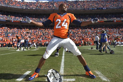 In this Jan. 19, 2014, photo, Denver Broncos cornerback Champ Bailey warms up before the AFC championship NFL playoff football game against the New England Patriots in Denver. In a cost-cutting move Thursday, March 6, 2014, the Broncos released Bailey, the team's defensive leader who's been a fan favorite since he was acquired in a trade with Washington in 2004. (AP Photo/Jack Dempsey)