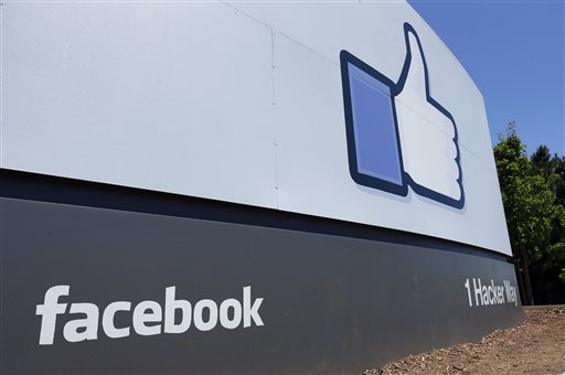 This Tuesday, July 16, 2013 file photo shows a sign at Facebook headquarters in Menlo Park, Calif. Facebook reports quarterly earnings on Wednesday, April 23, 2014. (AP Photo/Ben Margot, File)