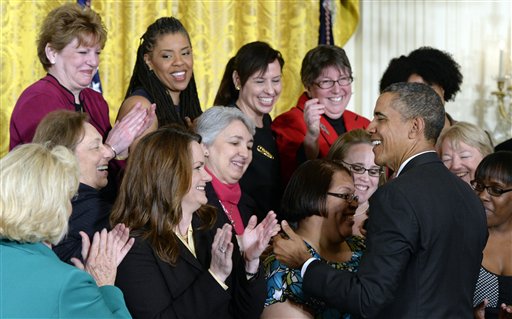President Barack Obama greets people in the East Room of the White House in Washington, Tuesday, April 8, 2014, during an event marking Equal Pay Day. The president announced new executive actions to strengthen enforcement of equal pay laws for women. The president and his Democratic allies in Congress are making a concerted election-year push to draw attention to women's wages. Lilly Ledbetter is at left in green. (AP Photo/Susan Walsh)