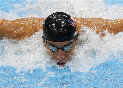 In this Aug. 4, 2012, file photo, United States' Michael Phelps swims in the men's 4 X 100-meter medley relay at the Aquatics Centre in the Olympic Park during the 2012 Summer Olympics in London. Phelps is coming out of retirement, the first step toward possibly swimming at the 2016 Rio Olympics. Bob Bowman, the swimmer's longtime coach, told The Associated Press on Monday, April 14, 2014, that Phelps is entered in three events  the 50- and 100-meter freestyles and the 100 butterfly at his first meet since the 2012 London Games at a meet in Mesa, Ariz., on April 24-26. (AP Photo/Julio Cortez, File)