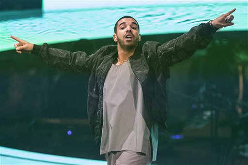 In this Oct. 24, 2013 file photo, Drake performs during his "Would You Like A Tour" show in Toronto. The Toronto-based rapper, singer and actor will host the July 16, 2014, ESPYs sports awards show on ESPN in Los Angeles. (AP Photo/The Canadian Press, Chris Young, file)