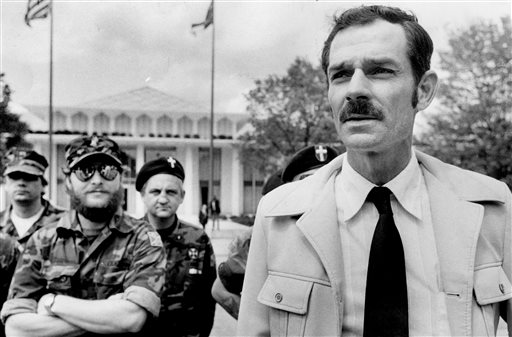 In this April 17, 1984 file photo, Glenn Miller, leader of the Carolina Knights of the Ku Klux Klan, holds a news conference in Raleigh, N.C.   Miller also known as Frazier Glenn Cross is suspected of fatally shooting two people Sunday afternoon in the parking lot behind the Jewish Community Center of Greater Kansas City, then driving to a retirement community where he shot a third person. He was arrested in an elementary school parking lot.(AP Photo/The News & Observer, File)