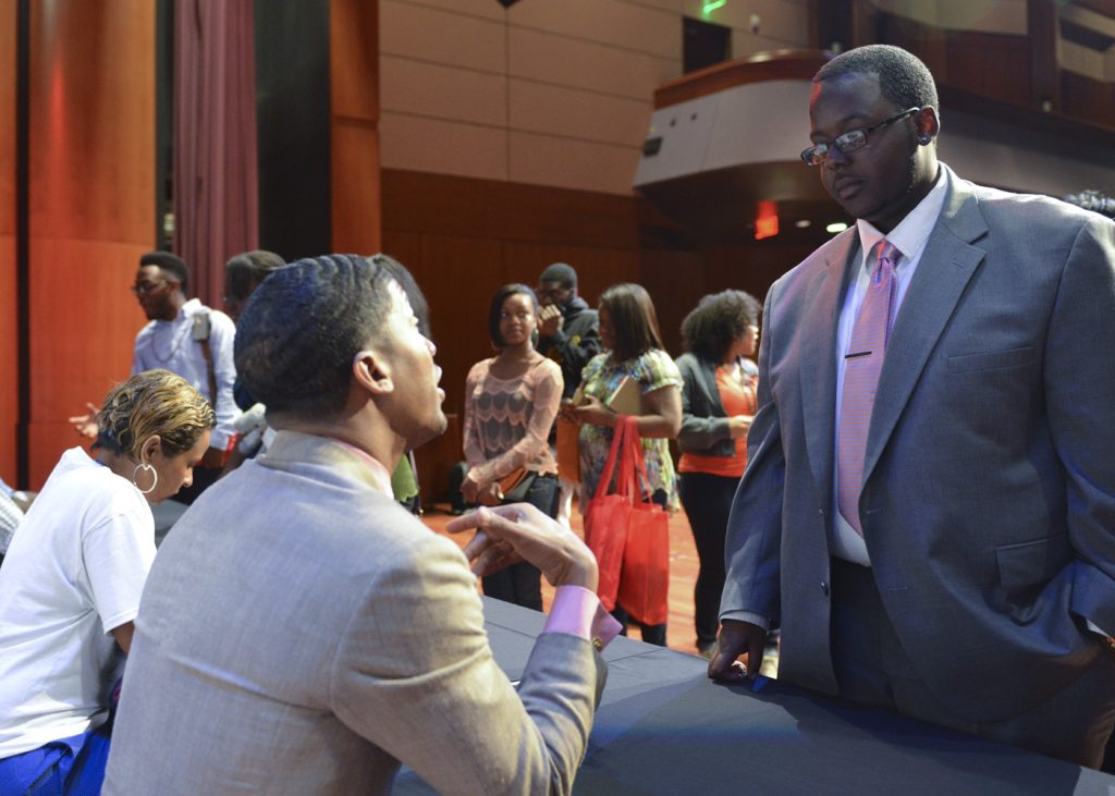 Ty’Quish Keyes, (right) a Buick Achievers Scholarship recipient, gets advice from Fonzworth Bentley, artist and pop culture icon during a celebrity meet and greet for a recent UNCF Empower Me Tour event in Atlanta, Ga. (Freddie Allen/NNPA)