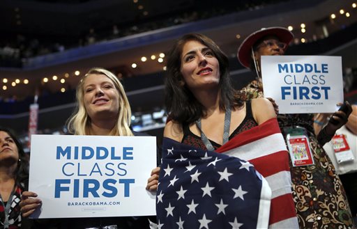 In this Sept. 5, 2012, file photo, delegates watch as former President Bill Clinton addresses the Democratic National Convention in Charlotte, N.C. Since 2008, the number of people who call themselves middle class has fallen by a fifth, according to a survey in January 2014 by the Pew Research Center, from 53 percent to 44 percent. (AP Photo/Jae C. Hong, File)