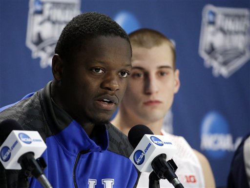Kentucky's Julius Randle, left, and Wisconsin's Ben Brust participate in a news conference for their NCAA Final Four tournament college basketball semifinal game Thursday, April 3, 2014, in Dallas. (AP Photo/David J. Phillip)
