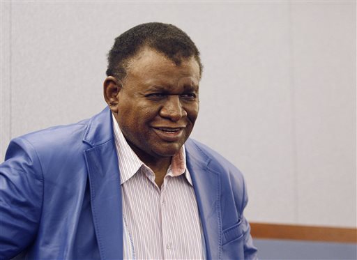 Comedian George Wallace smiles in court in Las Vegas on Tuesday, April 8, 2014 after a jury awarded him $1.3 million in his case against the Bellagio hotel-casino for a 2007 incident where he was injured on stage. (AP Photo/Las Vegas Review-Journal, John Locher)