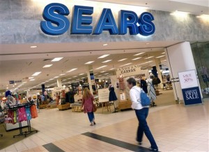 In this Monday, May 14, 2012, file photo, shoppers walk into Sears in Peabody, Mass. Sears reports quarterly earnings on Thursday, May 22, 2014. (AP Photo/Elise Amendola, File)
