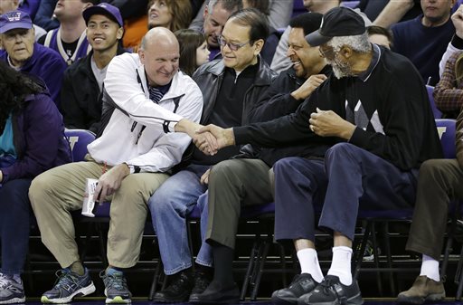 In this Jan. 25, 2014, photo, then-Microsoft CEO Steve Ballmer, left, shakes hands with former NBA players Bill Russell, right, and "Downtown" Freddie Brown as Omar Lee looks on during an NCAA college basketball game between Washington and Oregon State in Seattle. An individual with knowledge of negotiations to sell the Los Angeles Clippers said Shelly Sterling has reached an agreement to sell the team to Ballmer for $2 billion. The individual, who wasnt authorized to speak publicly, told The Associated Press on Thursday, May 29, 2014, that Ballmer and the Sterling Family Trust now have a binding agreement. The deal now must be presented to the NBA. (AP Photo/Elaine Thompson, File)