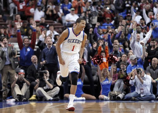 In this Oct. 30, 2013 file photo, Philadelphia 76ers' Michael Carter-Williams (1) celebrates after making a 3-point basket during the first half of an NBA basketball game against the Miami Heat, in Philadelphia. Carter-Williams has won the NBA's Rookie of the Year Award. The league said Monday, May 5, 2014,  that he received 104 of a possible 124 first-place votes. (AP Photo/Michael Perez, File)