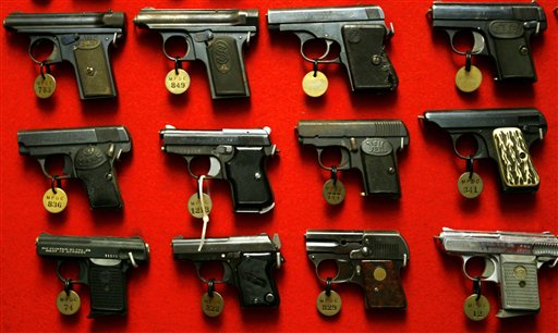 Guns line the walls of the firearms reference collection at the Washington Metropolitan Police Department headquarters in Washington on Sept. 28, 2007. (AP Photo/Jacquelyn Martin)