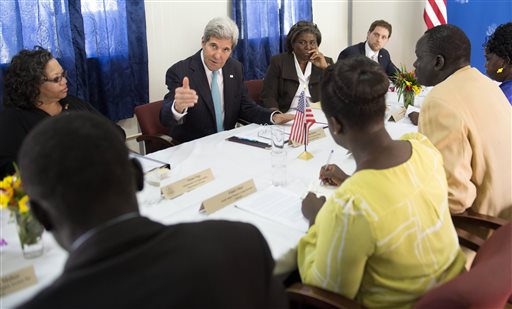 US Secretary of State John Kerry, center, meets with civil society leaders at the US embassy in Juba, South Sudan, Friday May 2, 2014. Kerry, landing in the capital Juba on Friday, carried the threat of U.S. sanctions against prominent South Sudanese leaders if the rampant violence doesn't stop. But more than anything, he sought to compel authorities on both sides of the fight to put aside personal and tribal animosities for the good of a nation that declared independence three years ago to escape decades of war. (AP Photo/Saul Loeb, Pool)