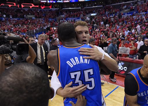 Oklahoma City Thunder forward Kevin Durant, hugs Los Angeles Clippers forward Blake Griffin after the Thunder won of Game 6 of the Western Conference semifinal NBA basketball playoff series, Thursday, May 15, 2014, in Los Angeles. The Thunder won104-98, taking the series 4-2. (AP Photo/Mark J. Terrill)