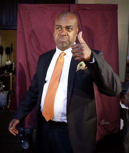 Newark mayoral candidate Ras Baraka gives a thumbs-up after casting his vote, Tuesday, May 13, 2014, in Newark, N.J. The election will decide whether Shavar Jeffries, a former state assistant attorney general, or Baraka, a city councilman, will take over the seat Cory Booker occupied from 2006 until October 2013, when he won a special election to succeed U.S. Sen. Frank Lautenberg, who died in office. (AP Photo)