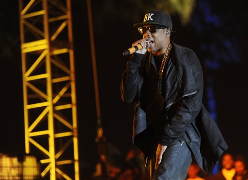 This April 12, 2014 file photo shows Jay Z at the 2014 Coachella Music and Arts Festival in Indio, Calif. Beyoncé and Jay Z lead in nominations for the BET Awards. The network announced Wednesday that the performers are both nominated for five awards, along with Drake. Pharrell and rising performer August Alsina have four nominations. The BET Awards will air live on June 29 from the Nokia Theatre L.A. Live. (Photo by Chris Pizzello/Invision/AP, File)