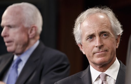 Sen. Bob Corker, R-Tenn., right, accompanied by Sen. John McCain, R-Ariz., listens during a news conference on Capitol Hill in Washington, Wednesday, April 30, 2014. Corker was the only Republican to cross party lines and vote "yes" in favor of allowing debate on the Minimum Wage Fairness Act to proceed.  The measure was stopped in the Senate,  handing a defeat to President Barack Obama on a vote that is sure to reverberate in this year's congressional contests. (AP Photo)