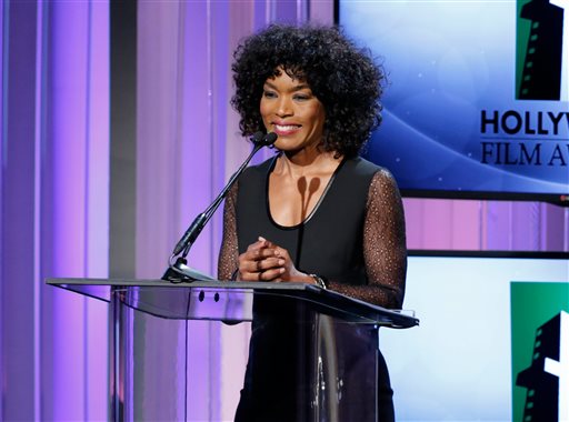 FILE - In this Oct. 21, 2013 file photo, actress Angela Bassett speaks on stage at the 17th Annual Hollywood Film Awards Gala at the Beverly Hilton Hotel in Beverly Hills, Calif. The Lifetime TV channel says it will air a movie about the relationship of Whitney Houston and Bobby Brown, with Bassett set to direct. The channel said Thursday, May 22, 2014, the movie will follow the couple through their first meeting and tumultuous marriage and Houstons rise to fame. (Photo by Todd Williamson/Invision/AP)