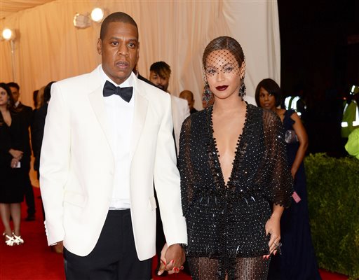 This May 5, 2014 file photo shows Jay Z, left, and Beyonce at The Metropolitan Museum of Art's Costume Institute benefit gala celebrating "Charles James: Beyond Fashion" in New York. Beyonce, Jay Z and Solange say they have worked through and are moving on since a video leaked this week of Solange attacking Jay Z in an elevator inside the Standard Hotel after the May 5, gala. (Photo by Evan Agostini/Invision/AP, File)