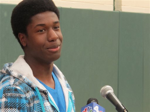 Kwasi Enin speaks at a news conference at William Floyd High School in Mastic Beach, N.Y., on Wednesday, April 30, 2014. Enin, who was accepted into all eight Ivy League colleges, announced he will attend Yale University in the fall. Enin says he wants to study medicine. His parents are both nurses and immigrated to the United States from Ghana in the 1980s. (AP Photo/Frank Eltman)