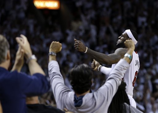 Miami Heat forward LeBron James celebrates their 96-94 win against the Brooklyn Nets  during after Game 5 of a second-round NBA playoff basketball game in Miami, Wednesday, May 14, 2014. (AP Photo)