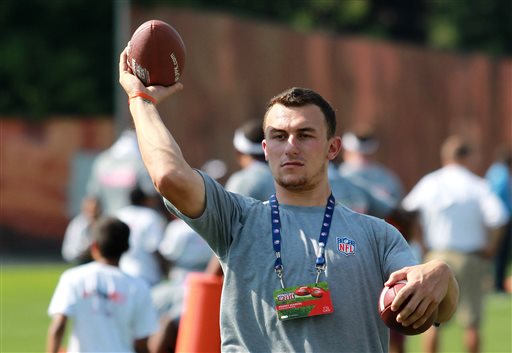 Cleveland Browns' Johnny Manziel throws a pass during an NFL football Play 60 youth event at the Cleveland Browns practice facility Friday, June 27, 2014, in Berea, Ohio. The AFC rookies took part in the NFL's annual Rookie Symposium. (AP Photo/Aaron Josefczyk)