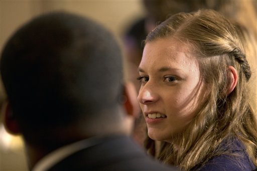 Rebecca Jasen, of Amherst, N.Y., attends a Tumblr forum where President Barack Obama answered questions from the State Dining Room of the White House in Washington, Tuesday, June 10, 2014. (AP Photo/Jacquelyn Martin)