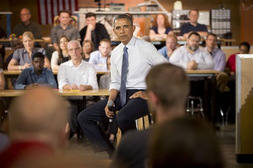President Barack Obama listens to a question from a member of the audience during his visit to TechShop, Tuesday, June 17, 2014, in Pittsburgh, Pa. (AP Photo/Pablo Martinez Monsivais)