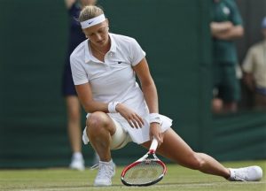 Petra Kvitova of the Czech Republic looks down after winning a point to Mona Barthel of Germany during their women's singles match at the All England Lawn Tennis Championships in Wimbledon, London, Wednesday, June 25, 2014. (AP Photo/Sang Tan)